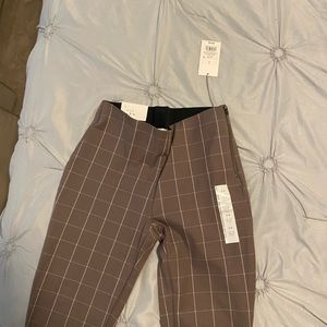 Tan with a light checkered pattern pants. Straight to ankle. Brand new